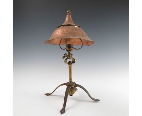 A Birmingham Guild of Handicraft copper and brass table/reading lamp, the copper double domed shade supported on three arms, 