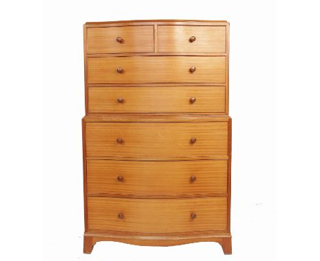 A 20th century slightly serpentine fronted chest on chest, having two short drawers over two long drawers to the upper sectio