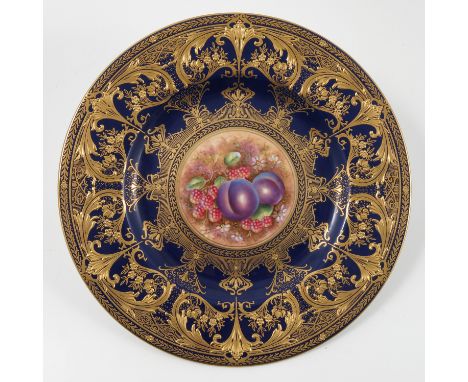 A Royal Worcester plate, decorated with raspberries and plums by Brian Leaman to a deep blue and gilt border, diameter 10.75i