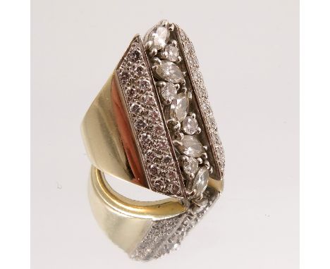 A diamond ring, the central line of alternating marquise and brilliant cuts with two rows of eighteen brilliant cuts pave set