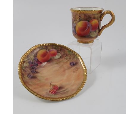 A Royal Worcester coffee cup and saucer, decorated with fruit by Love, circa 1954/5 Condition report: Good condition