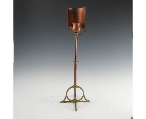 A Birmingham Guild of Handicraft copper and brass table lamp, with curved copper reflector, the flower bud light holder suppo