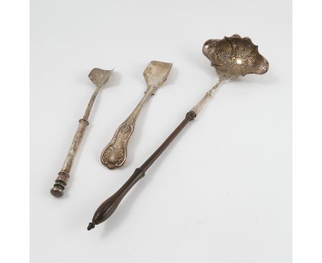 A silver punch ladle, with turned wooden handle, the shaped oval bowl with embossed decoration, London 1751, together with tw