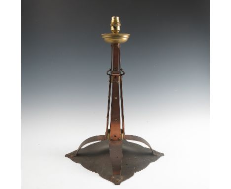 An Arts and Crafts copper and brass table lamp, not stamped but possibly Birmingham Guild of Handicraft, the brass drip tray 