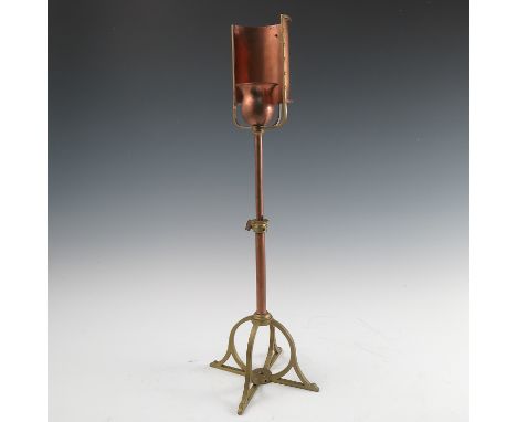 A Birmingham Guild of Handicraft copper and brass table lamp, with curved copper reflector, the flower bud light holder suppo