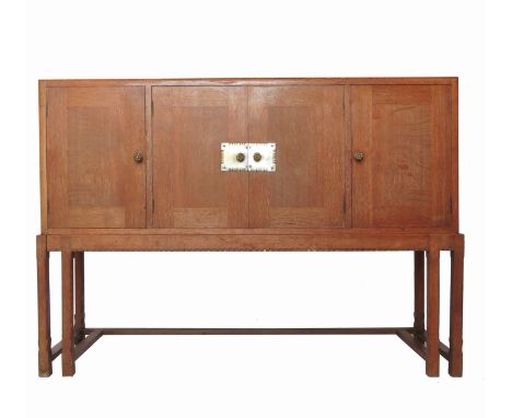 A Heals style limed oak sideboard, having two central doors opening to reveal a shelf and three drawers, flanked by two furth