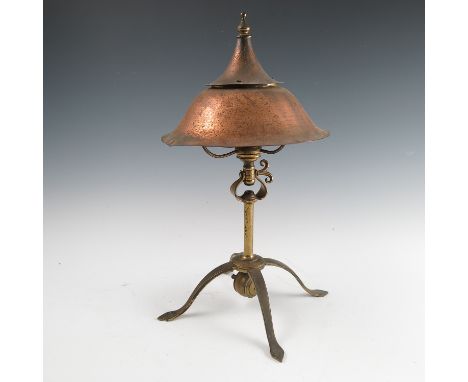 A Birmingham Guild of Handicraft copper and brass table/reading lamp, the copper double domed shade supported on three arms, 