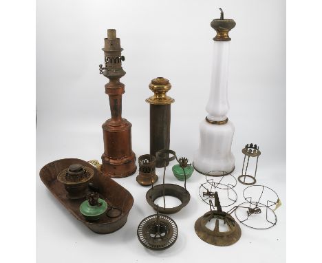 A collection of sundry oil lamp parts, to include lamp bases, reserves, shade holders etc, together with various metal tins e