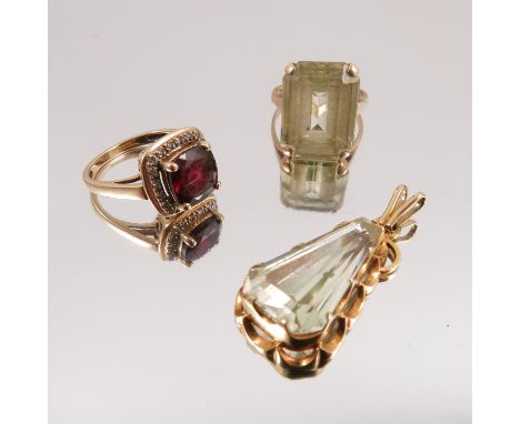 A garnet and diamond cluster ring, a synthetic set 9 carat gold dress ring with a similarly set pendant