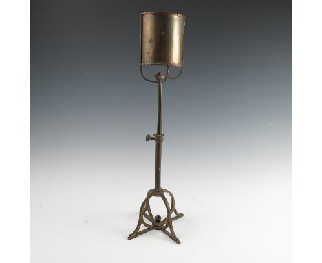 A Birmingham Guild of Handicraft copper and brass table lamp, with curved copper reflector, the flower bud light holder now m