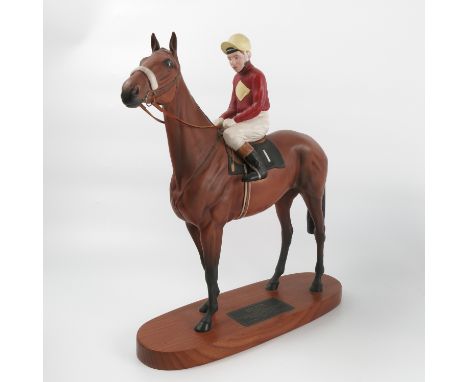 A Beswick model, of Red Rum with Brian Fletcher up, mounted on an oval base with Beswick plaque, height 13.5ins Condition rep