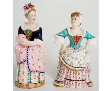 Two Minton porcelain candlestick figures one modelled as a lady in 18th Century dress with bows in her hair, her hands on her
