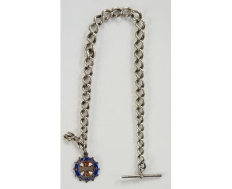 A silver fob chain and T bar with attached red, white and blue enamelled silver medallion depicting a steam engine to one sid