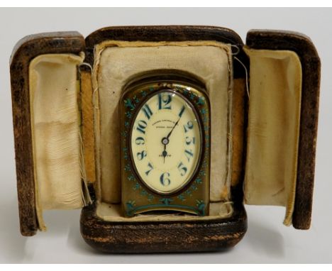 A Swiss silver and enamel miniature timepiece of shallow arched form the olive green enamel with two tone green stylised leaf