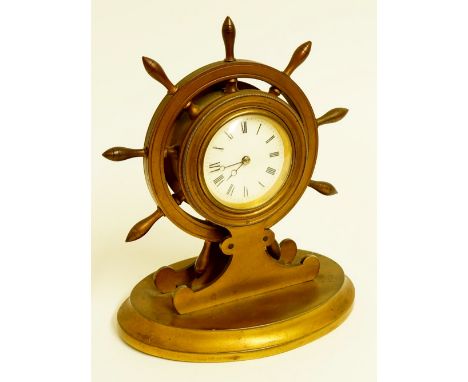 A 19th Century gilt bronze novelty clock modelled as a ship's wheel, the centre with white enamel dial with Roman numerals, o