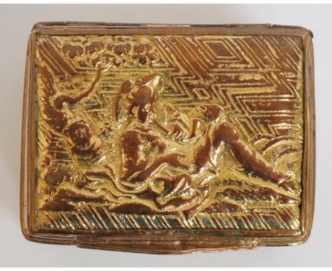 A Continental gilded copper snuff box the hinged lid cast with a gentleman, recumbent, smoking beneath a tree, the sides with