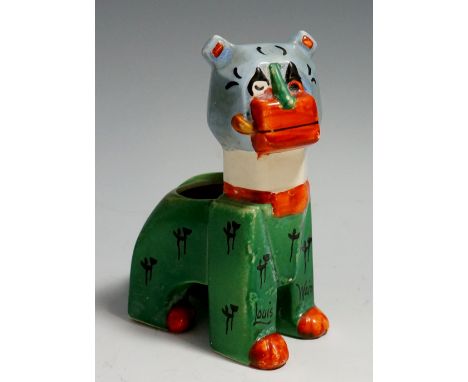 An English pottery Louis Wain model of a futuristic cat, seated smoking a pipe, painted green, black, grey, orange and brown,
