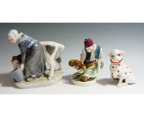 A Royal Copenhagen figure of a milkmaid and calf, 16cm high, painted mark in under glaze blue, printed mark in green and numb