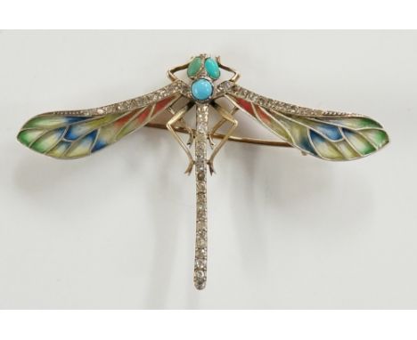 A Plique-à-Jour enamel dragonfly brooch the insect's eyes and abdomen set turquoise its wing edge and body pavé set diamonds,