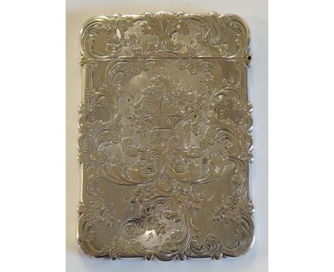 A Victorian shaped rectangular card case, foliate scroll border with engine turned wriggle pattern body, the central cartouch