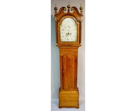 A George III oak cottage longcase clock the hood with swan neck pediment terminating in embossed brass roundels and three bra