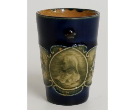 A Doulton Lambeth miniature commemorative beaker relief decorated with a portrait of Nelson flanked by sea battles in green o