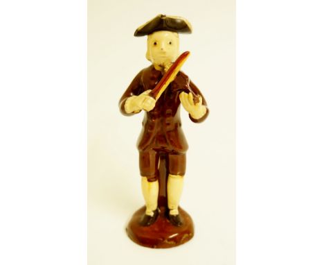 An Astbury-Whieldon type figure of a violin player wearing tricorn hat, brown coat and breeches, circular domed base, 16cm hi