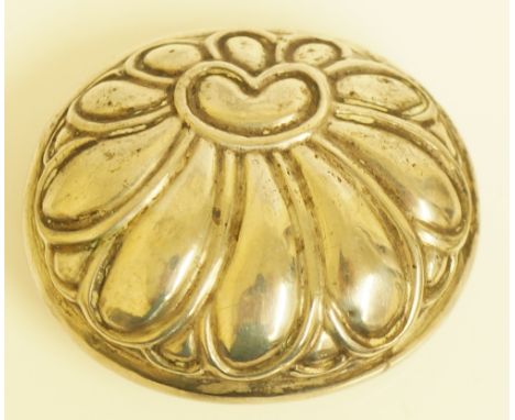 A Continental silver coloured metal snuff box of oval form the hinged lid embossed with a stylised flower head, the base engr