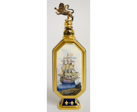 A Lynton porcelain scent flask of elongated octagonal form with cylindrical silver gilt neck and lion mounted stopper the blu