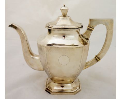 A Chinese urnular shaped teapot in Georgian style, the hinged cover with urnular shaped finial, plain neck above textured bod