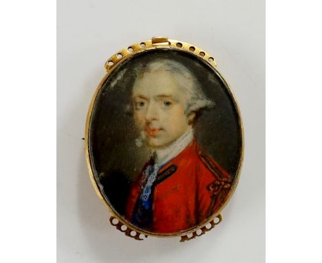 A George III oval portrait miniature of a young gentleman in red coat, gold frame with detachable clasp, 3.5cm x 3cm (faults)