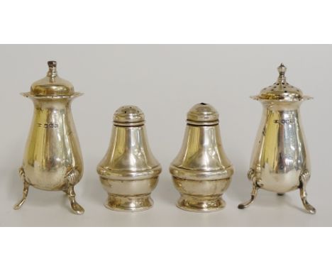 A matched pair of salt & pepper pots of vasular shape on shell and hoof feet, Henry Wilkinson, Sheffield 1925 & 1926; togethe