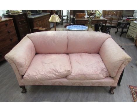 A Howard &amp; Sons sofa on claw and ball feet, rear legs stamped, 84cm wide 