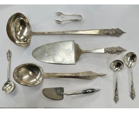 Mixed Thai Sterling and white metal serving instruments including six pieces by Alex &amp; Co, ladle, cake knife, spoons and 