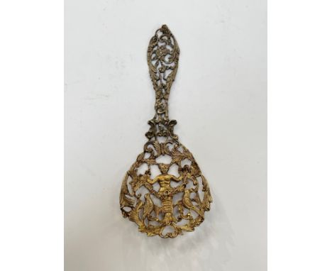 A William Comyns silver gilt pierced highly decorative caddy spoon, 28g, 12.5cm long 