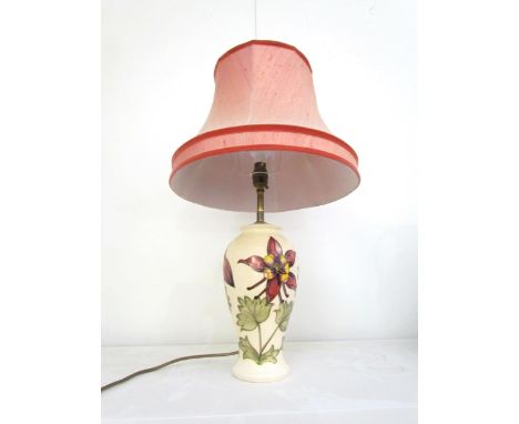 A Moorcroft Aquilegia pattern table lamp, cream ground 