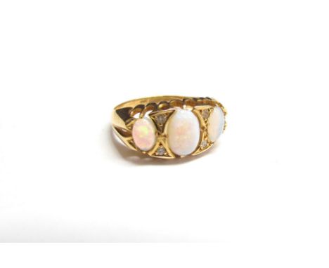 An 18ct gold opal and diamond ring. Size L, 3g 