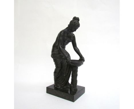 A late 19th Century French Grand Tour style bronze figure of Danaides with a bowl. The female figure leaning over a twin hand