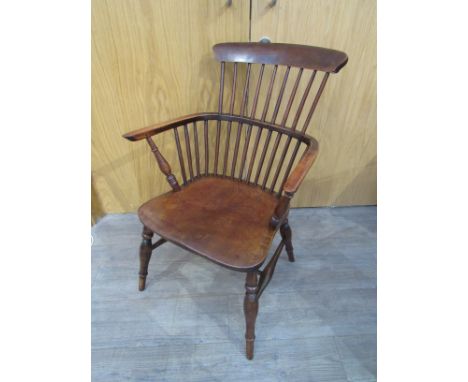 A circa 1860 elm and ash "Thames Valley" raised stick back armchair on turned legs united by an "H" stretcher 