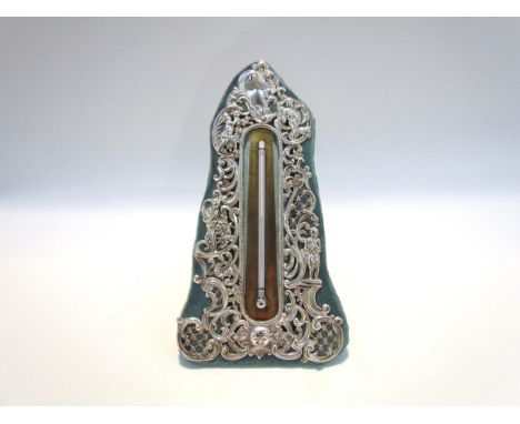 A William Comyns silver easel-back table thermometer, pierced design of the four seasons and sun, London 1898, 18cm tall 