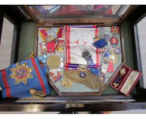 A collection of Masonic and RAOB medals and regalia including silver gilt and sash, some relating to UK and overseas military