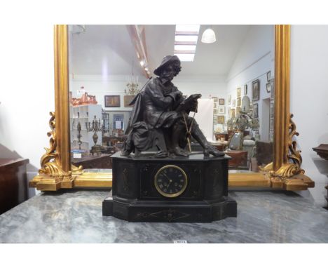 A 19th Century large state mantel clock, aloft a seated gent wearing period costume and hat holding a book, gilt Roman numera
