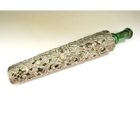 A Henry Matthews silver scent bottle cover with embossed and pierced scroll decoration, Birmingham 1902, 43.1g with a green g