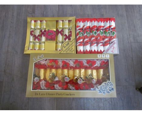 A box containing unused vintage crackers including Tom Smith 
