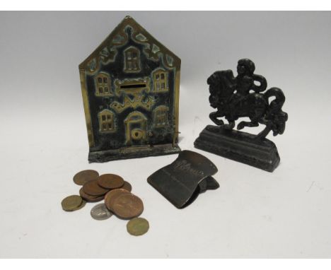 A Georgian wrought metal Yorkshire Bank money box with brass windows, door and street lamp, 19cm x 13cm cast metal door stop 