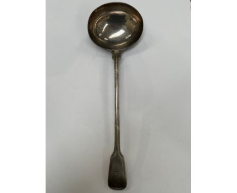 A Chawner &amp; Co (George William Adams) silver soup ladle, reeded detail, emblem of arm holding a dagger, London 1852, 303g