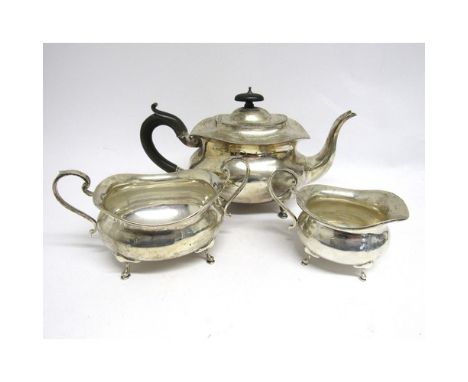 A Stewart Dawson &amp; Co Ltd silver three piece teaset, teapot, scroll handle, hoof feet, 16cm tall x 28cm long, milk jug an