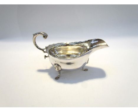 A Haseler Brothers (Edward John Haseler &amp; Noble Haseler) silver sauce boat, scrolled handle, lion mask mounted hoof feet,