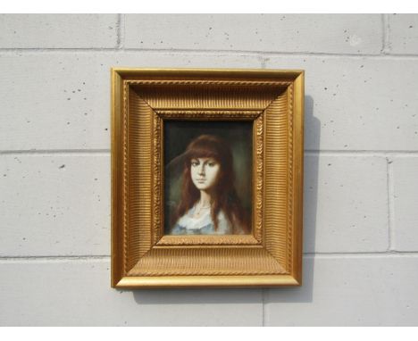 An unsigned oil on board portrait of a young woman with red hair, set in an ornate gilt frame and glazed. Image size 24cm x 1