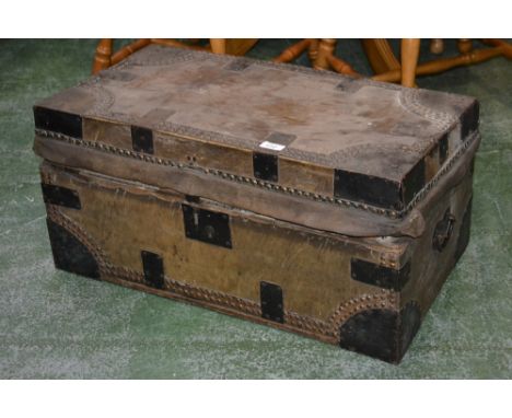 A 19th century mule skin covered trunk, metal bound and studded.